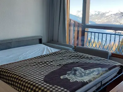 Un ou plusieurs lits dans un hébergement de l'établissement Appartement 2 pièces pour 4 pers. à Arc 1800, balcon et cuisine équipée - FR-1-411-840