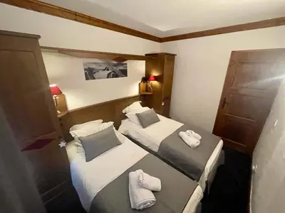 Un ou plusieurs lits dans un hébergement de l'établissement Arc 1950 - Appt 2CH - 6 pers - Rés 5* luxe - Piscine, sauna, hamman, jacuzzi - Classé 5 cristaux Paradiski