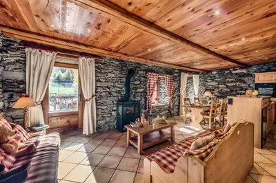 Coin salon dans l'établissement Chalet Les Champs Du Pont - LA GRANDE FERME 9 Pièces 15 pers. Appartement en chalet - 205m² MAE-6964
