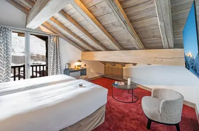 Un ou plusieurs lits dans un hébergement de l'établissement Hôtel L'Aigle du Montana by Les Etincelles