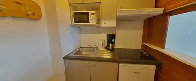 Cuisine ou kitchenette dans l'établissement Tignes rond point des pistes vue panoramique au soleil