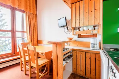 Cuisine ou kitchenette dans l'établissement Résidences quartier Charmettoger - maeva Home - Studio vue montagne + mezzanine 5 personnes - Budget MAE-0813