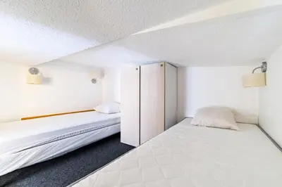 Un ou plusieurs lits dans un hébergement de l'établissement Résidences quartier Charmettoger - maeva Home - Studio 6 personnes - Confort MAE-0821