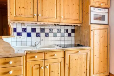 Cuisine ou kitchenette dans l'établissement Résidence Les Alpages de Chantel - maeva Home - Appartement 3 Pièces 6 Personnes - Sélection MAE-1538
