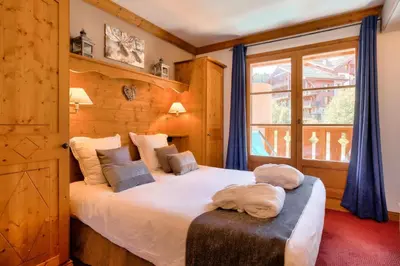 Un ou plusieurs lits dans un hébergement de l'établissement Résidence Les Arcs 1950 Le Village - maeva Home - 3 Pièces 6 Personnes Prestige - Prince des Cîmes MAE-5948