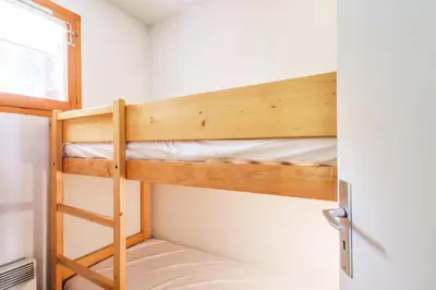 Un ou plusieurs lits superposés dans un hébergement de l'établissement Résidences quartier Charmettoger - maeva Home - Appartement 3 pièces 6 personnes - Budget MAE-4507
