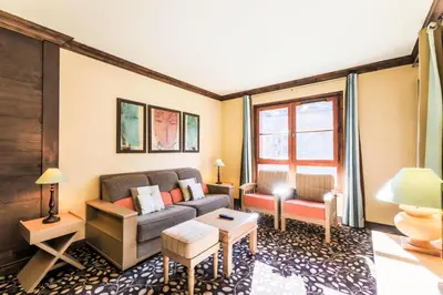 Coin salon dans l'établissement Résidence Les Arcs 1950 Le Village - maeva Home - Appartement 2 pièces 4 personnes - Sélection MAE-3894