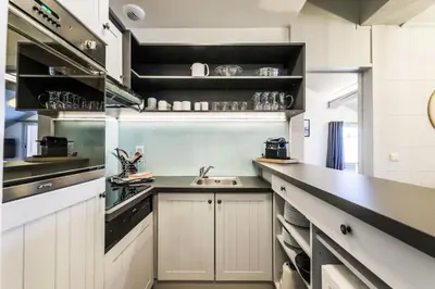 Cuisine ou kitchenette dans l'établissement Résidence Les Arcs 1950 Le Village - maeva Home - Appartement 3 pièces 6 personnes - Prestige - super Home MAE-3896