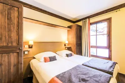 Un ou plusieurs lits dans un hébergement de l'établissement Résidence Les Arcs 1950 Le Village - maeva Home - Appartement 3 pièces 6 personnes Sélection MAE-2661