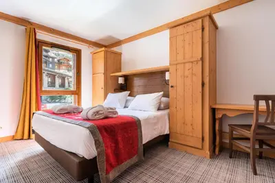 Un ou plusieurs lits dans un hébergement de l'établissement Résidence Les Arcs 1950 Le Village - maeva Home - Appartement 3 Pièces 6 Personnes - Prestige MAE-6704