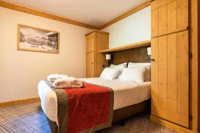 Un ou plusieurs lits dans un hébergement de l'établissement Résidence Les Arcs 1950 Le Village - maeva Home - Appartement 3 Pièces 6 Personnes - Prestige MAE-1564