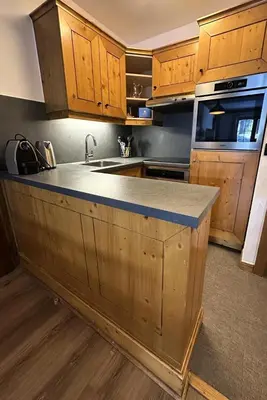 Cuisine ou kitchenette dans l'établissement Résidence Les Arcs 1950 Le Village - maeva Home - Appartement 3 pièces 6 personnes - Prestige MAE-5494