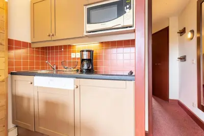 Cuisine ou kitchenette dans l'établissement Résidences quartier Charmettoger - maeva Home - Studio 4 personnes - Sélection MAE-7494