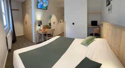 Un ou plusieurs lits dans un hébergement de l'établissement Village de vacances Fleurs et Neige