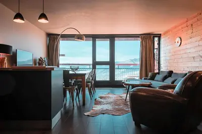Coin salon dans l'établissement Résidence Nova - Très beau duplex, entièrement rénové pour 8 personnes, proche des pistes et des commerces, au centre de la station d'Arc 1800 da MAE-1663