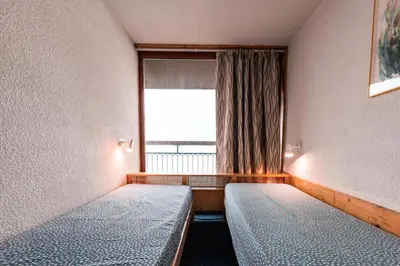 Un ou plusieurs lits dans un hébergement de l'établissement Résidence Nova - Appartement 2 pièces 6 personnes proche des pistes, des commerces, de la garderie et de l'ESF au centre de la station d’Arc 1800 MAE-1716