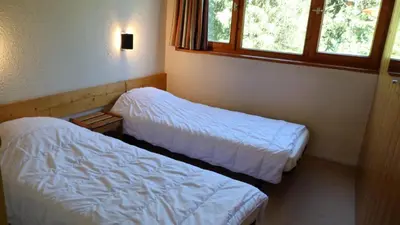 Un ou plusieurs lits dans un hébergement de l'établissement Résidence Nova - Appartement 3 pièces 7 personnes, proche des pistes, des commerces, de la garderie et de l'ESF au centre de la station d’Arc 180 MAE-2174