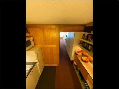 Cuisine ou kitchenette dans l'établissement Résidence Lauzieres - Appartement 3 pièces pour 8 personnes skis aux pieds et proche des commerces dans le village du Charvet à Arc 1800 MAE-4484