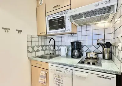 Cuisine ou kitchenette dans l'établissement Résidence Le Pramecou - Appartement de charme 6 personnes à Tignes proche des pistes et des commerces dans le quartier du Val Claret. Appartement situé MAE-2016