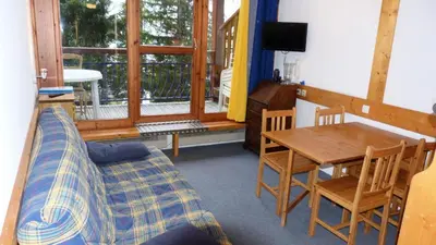 Coin salon dans l'établissement Résidence Aiguille Grive Bat Iii - Appartement 2 pièces 6 personnes en duplex, skis aux pieds, dans le village de Charmettoger à Arc 1800 MAE-1895