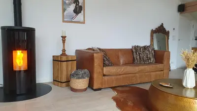 Coin salon dans l'établissement Chalet entier 110m2 avec vue et sauna à 10 min des pistes
