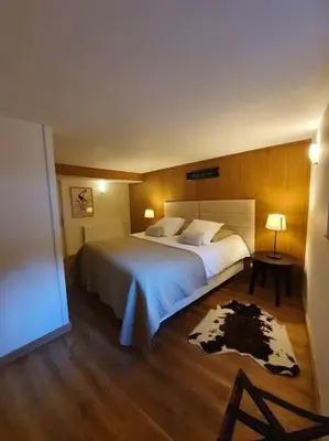 Un ou plusieurs lits dans un hébergement de l'établissement Appartement Gentiane de 85m2 avec sauna à 10 min des pistes