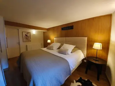Un ou plusieurs lits dans un hébergement de l'établissement Appartement Gentiane de 85m2 avec sauna à 10 min des pistes