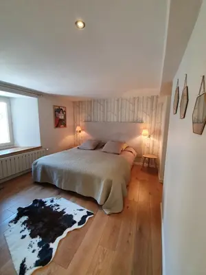 Un ou plusieurs lits dans un hébergement de l'établissement Appartement Gentiane de 85m2 avec sauna à 10 min des pistes