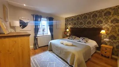 Un ou plusieurs lits dans un hébergement de l'établissement Appartement Marquise de 110m2 avec vue et sauna à 10 min des pistes