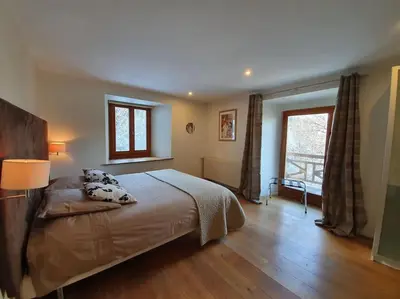 Un ou plusieurs lits dans un hébergement de l'établissement Appartement Marquise de 110m2 avec vue et sauna à 10 min des pistes
