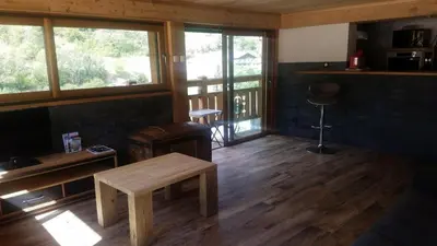 Coin salon dans l'établissement Appartement avec vue panoramique à Champagny - La Joubarbe