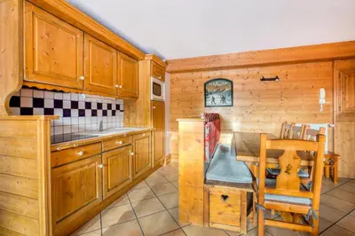 Cuisine ou kitchenette dans l'établissement Résidence Les Alpages de Chantel - maeva Home - Appartement 4 Pièces 8 Personnes - Sélection MAE-1649
