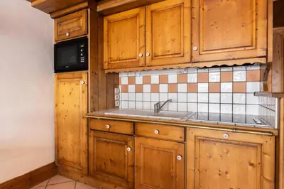 Cuisine ou kitchenette dans l'établissement Résidence Les Alpages de Chantel - maeva Home - Appartement 3 Pièces 6 Personnes - Sélection MAE-1652