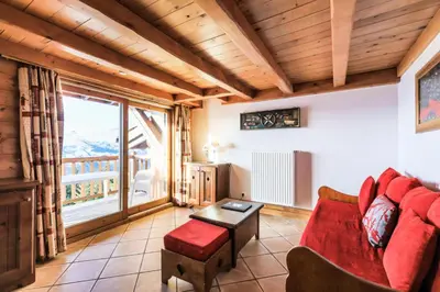 Coin salon dans l'établissement Résidence Les Alpages de Chantel - maeva Home - Appartement 3 pièces 6 personnes Sélection MAE-8772