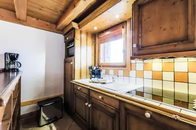 Cuisine ou kitchenette dans l'établissement Résidence Les Alpages de Chantel - maeva Home - Appartement 3 pièces 6 personnes Sélection MAE-8772