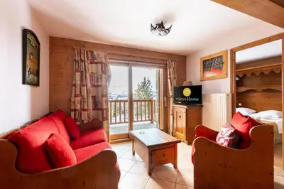 Coin salon dans l'établissement Résidence Les Alpages de Chantel - maeva Home - Appartement 4 Pièces 8 Personnes - Sélection MAE-6507