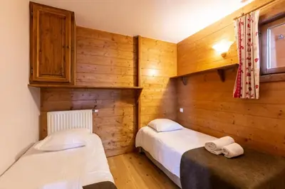 Un ou plusieurs lits dans un hébergement de l'établissement Résidence Les Alpages de Chantel - maeva Home - Appartement 4 Pièces 8 Personnes - Sélection MAE-6507