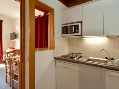Cuisine ou kitchenette dans l'établissement Confortable appartement avec mezzanine, 5 pers, animaux admis, wifi - FR-1-181-2067
