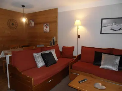 Coin salon dans l'établissement Appartement cosy skis aux pieds, animaux admis - FR-1-181-2157