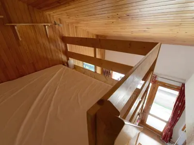 Un ou plusieurs lits dans un hébergement de l'établissement Appartement spacieux 5 pers · Skis aux pieds · Balcon vue pistes - FR-1-181-2180