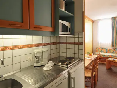 Cuisine ou kitchenette dans l'établissement Studio divisible fonctionnel · Accès pistes · Animaux admis - FR-1-181-2251
