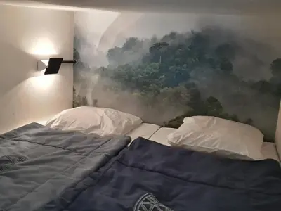 Un ou plusieurs lits dans un hébergement de l'établissement Appartement rénové calme avec balcon, parking, wifi – 7/8 pers - FR-1-346-305