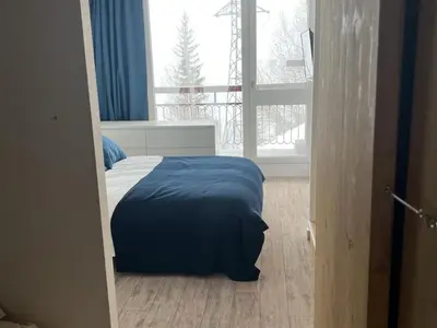 Un ou plusieurs lits dans un hébergement de l'établissement Appartement chaleureux 3 pièces, 6/7 pers, WiFi, proche station - FR-1-346-325