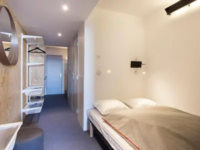 Un ou plusieurs lits dans un hébergement de l'établissement Studio rénové 5 pers, balcon, vue Mont Blanc - FR-1-346-376