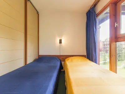 Un ou plusieurs lits dans un hébergement de l'établissement Duplex ski aux pieds avec balcon, 6 pers. - FR-1-346-405