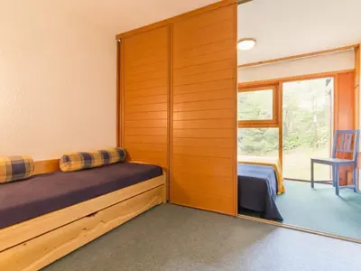Un ou plusieurs lits dans un hébergement de l'établissement Duplex ski aux pieds avec balcon, 6 pers. - FR-1-346-405