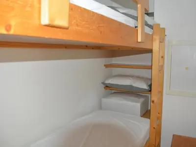 Un ou plusieurs lits dans un hébergement de l'établissement Duplex confortable ski aux pieds avec balcon - FR-1-346-411