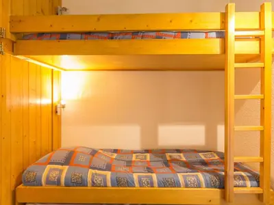 Un ou plusieurs lits dans un hébergement de l'établissement Studio lumineux 5 pers, ski aux pieds, balcon - FR-1-346-425