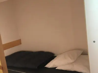 Un ou plusieurs lits dans un hébergement de l'établissement Appartement duplex calme 5 pers. proche pistes avec balcon - FR-1-346-430