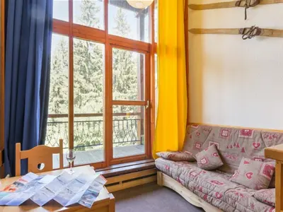 Coin salon dans l'établissement Appartement duplex calme 5 pers. proche pistes avec balcon - FR-1-346-430